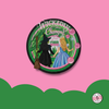 Circular badge with witch and fairy design on a pink background