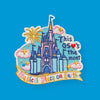 “Embroidered patch featuring a pastel fairy-tale castle with flags, fireworks, clouds, and stars on a light blue background, with decorative stitched text.”