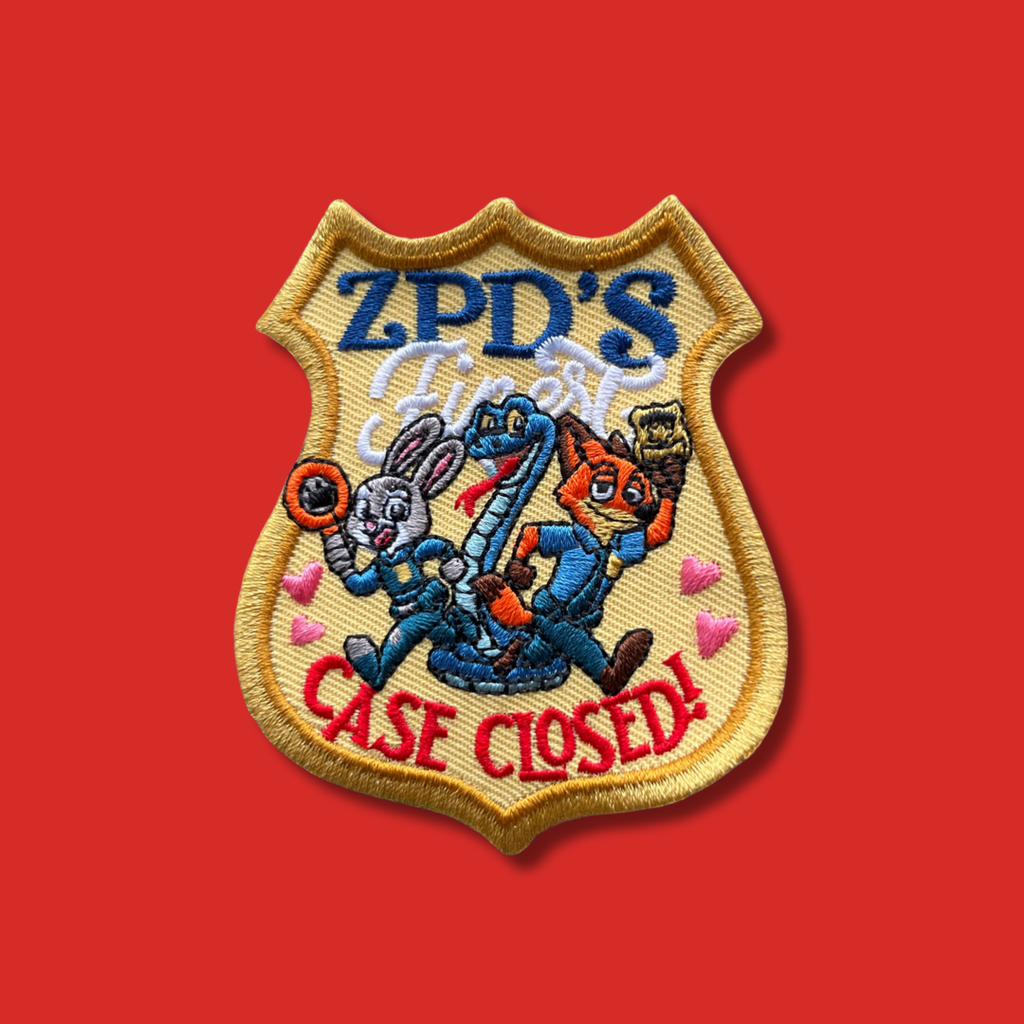 Embroidered badge-style patch with three cartoon animal detectives and ‘Case Closed’ text.