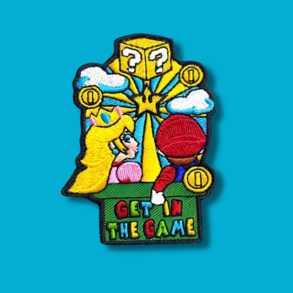 Embroidered ‘Get in the Game’ patch with retro game-inspired graphics.