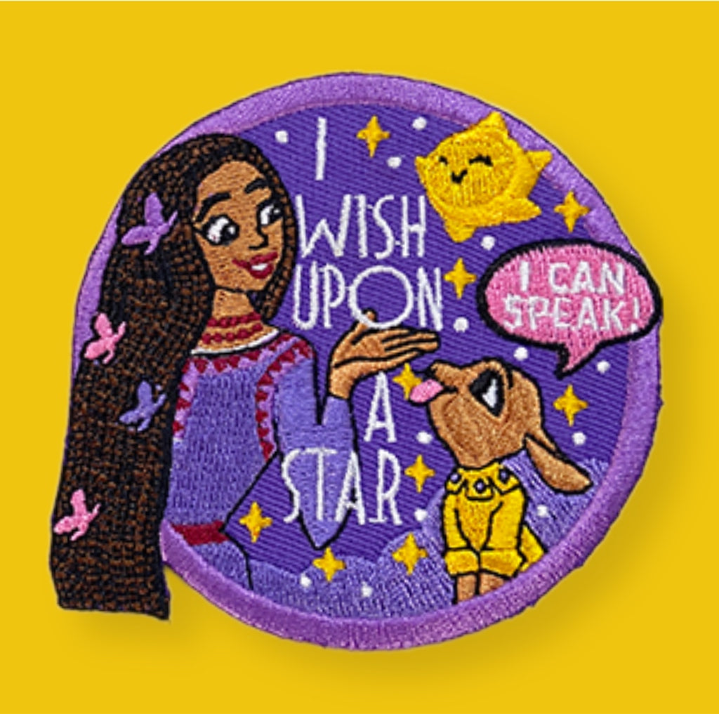 Embroidered patch with a girl and dog on a purple background with text 'I wish upon a star' and 'I can speak'.