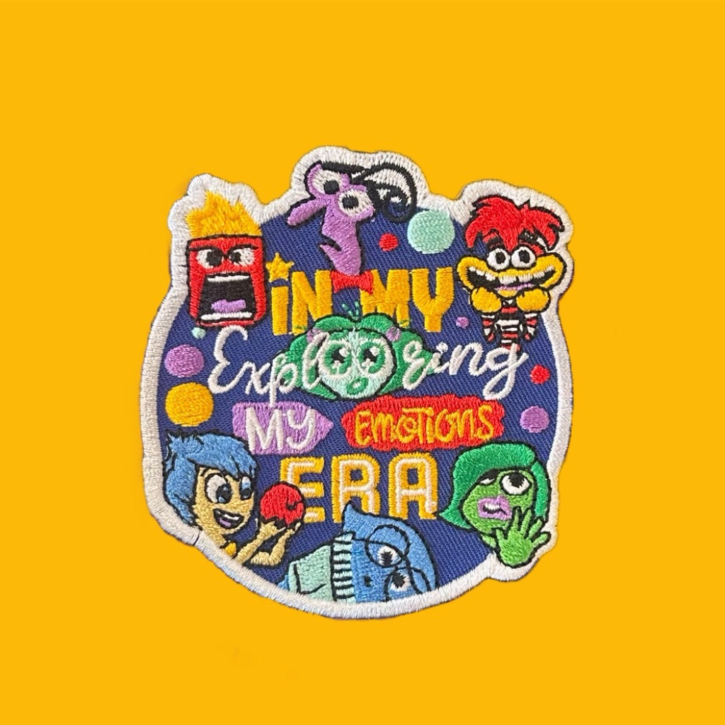 Colorful patch with cartoon characters and text on a yellow background