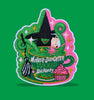 Embroidered patch featuring two stylized witch figures peeking from a green teacup with swirling steam, sparkles, a broom, and a cupcake, in bright green and pink colors on a solid background.