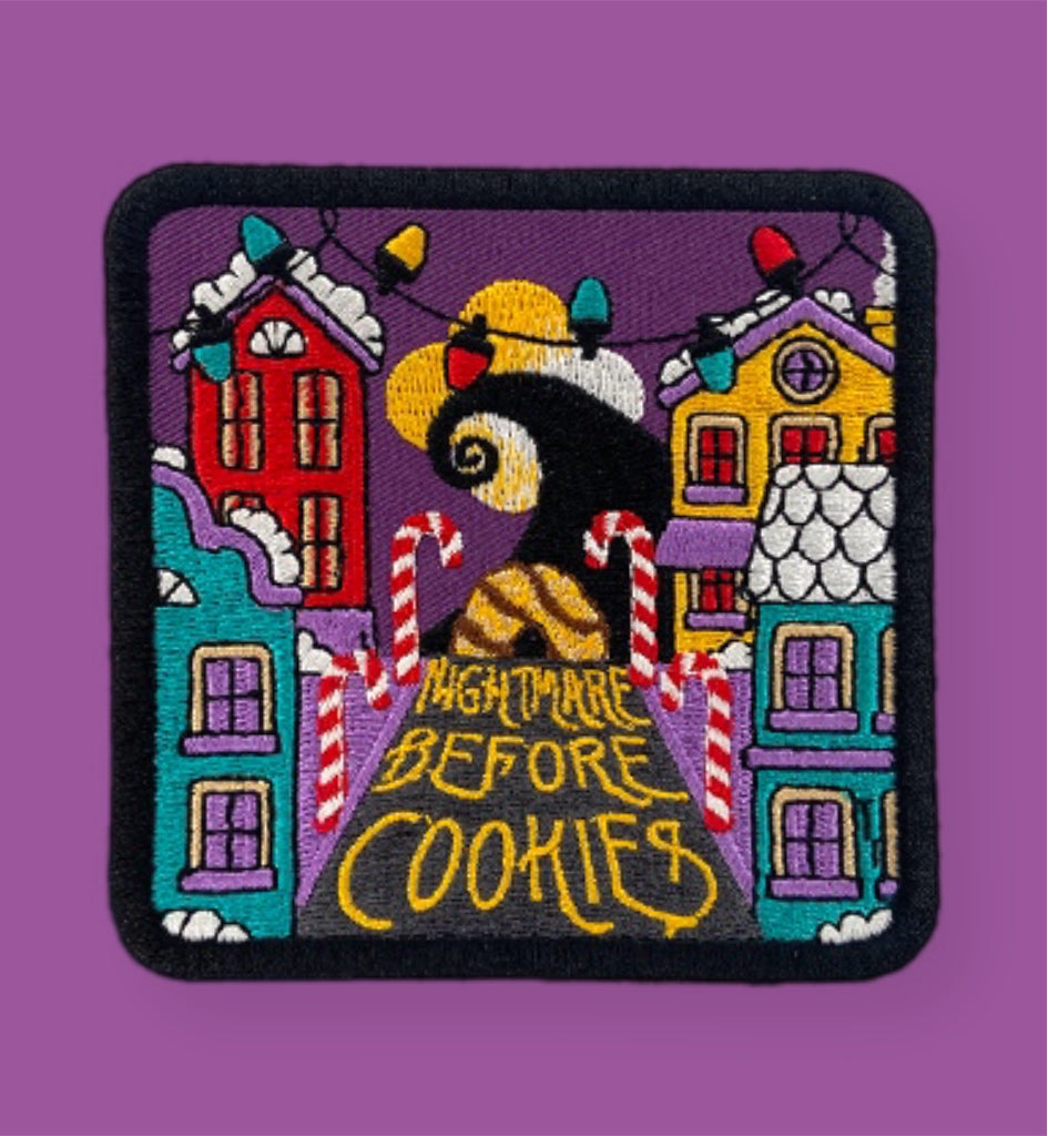 Patch with cartoon character and texts on a purple background