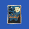“Rectangular embroidered patch showing a night scene with a flying figure silhouetted against a full moon above a city skyline, with decorative stars on a blue background.”