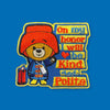 Embroidered patch featuring a friendly cartoon bear wearing a coat and hat, holding a small tag, standing beside stacked colorful text blocks with a heart icon on a blue background.
