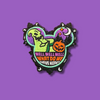 “Embroidered Halloween-themed patch shaped like a mouse head, featuring a green spooky figure leaning on a pumpkin, with a purple night sky, moon, and stars.”