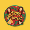 Round embroidered patch with a red background featuring the phrase “Little Women” in decorative lettering, surrounded by illustrated leaves, flowers, and faceless female silhouettes in warm tones.